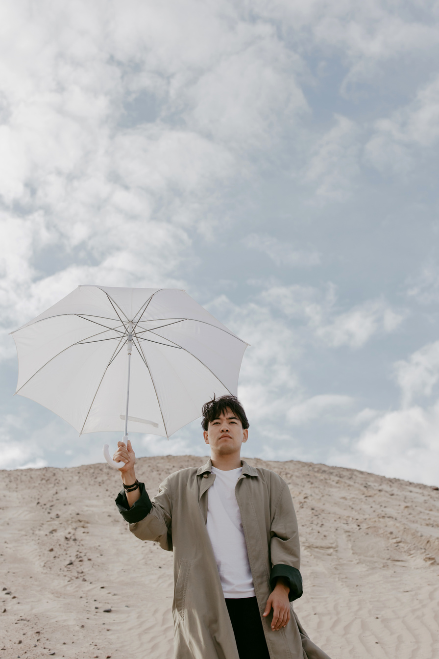 A Man Holding White Umbrella